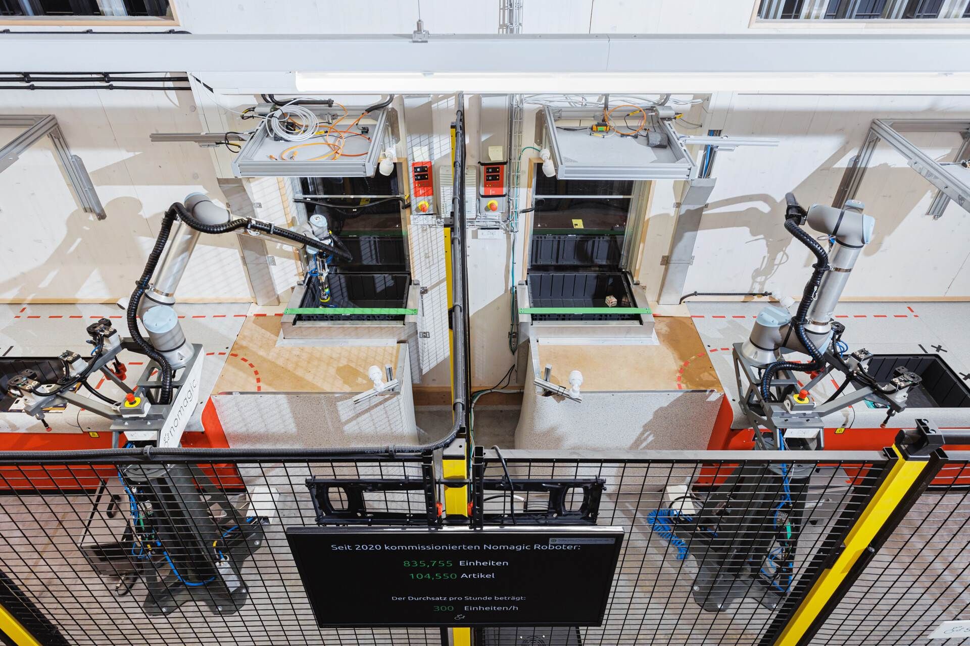 nomagic robots working together overhead