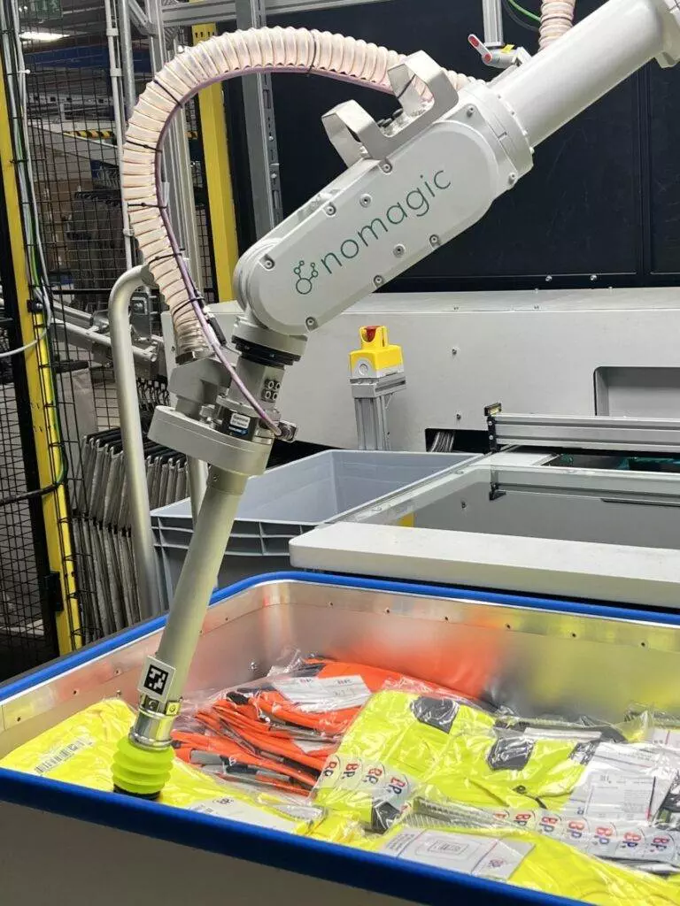 Nomagic robot picking hi-viz jackets at Fiege