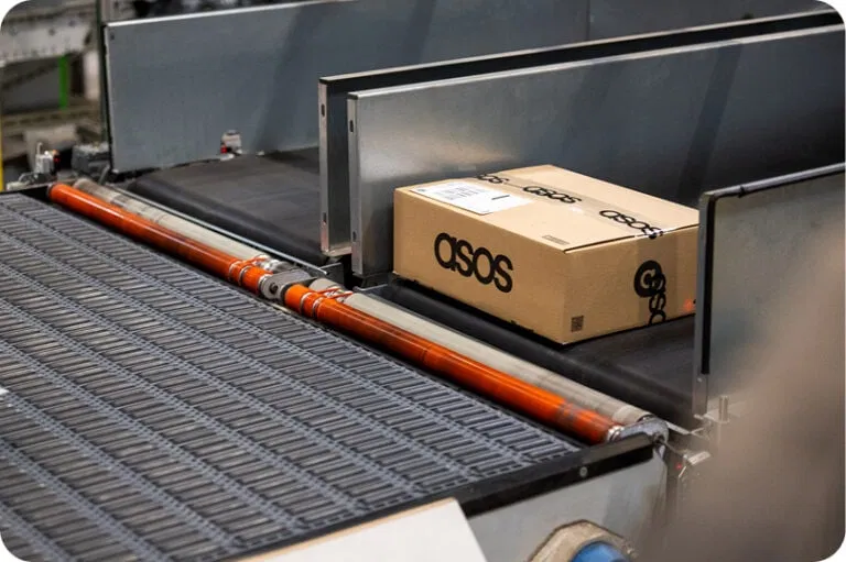 A package on a conveyor belt in an ASOS warehouse
